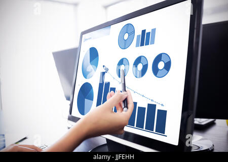 Blue graphics on white background against  casual businesswoman touching her computer  Casual businesswoman touching her computer with a pen Stock Photo