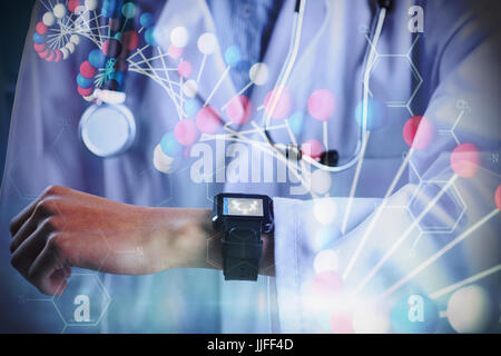 Mid section of female doctor showing smart watch  against blue dna strand with chemical structures Stock Photo