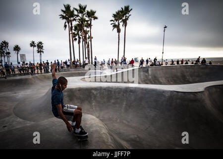 A skateboarder in action at Venice Beach Skate Park in Los Angeles, California, USA Stock Photo