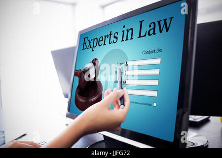 Graphic interface of lawyer contact form  against  casual businesswoman touching her computer  Casual businesswoman touching her computer with a pen Stock Photo