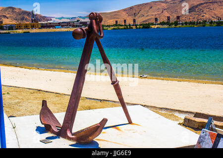 Vintage Iron Anchor On Display At Small Beach Stock Photo