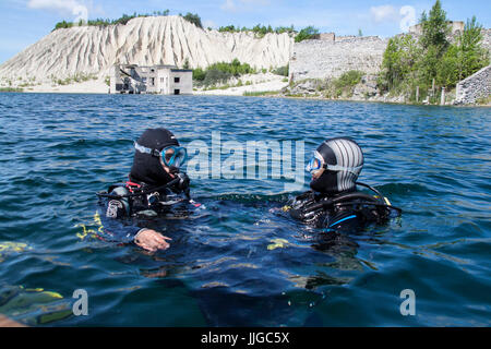A scuba diver getting last instructions before the dive Stock Photo