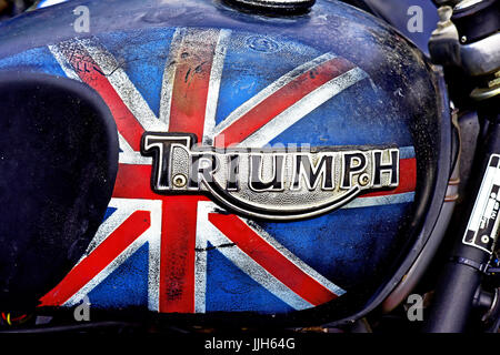 Battered roughly painted uinion flag Triumph motorbike petrol tank Stock Photo