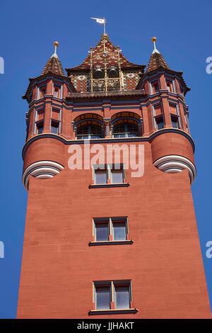 Tower of the red medieval Basel Town Hall ('Rathaus') with blue sky, in downtown Basel, Switzerland Stock Photo