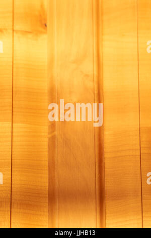 Closeup of European cherry tree timber furniture in sunshine - natural textured background Stock Photo