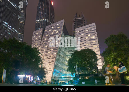 Futuristic facade of the new Guangzhou Library at night - modern Chinese public service architecture Stock Photo