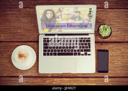 Composite image of online courses against overhead view of office desk with laptop and documents Stock Photo