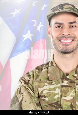 Smiling soldier in front of american flag Stock Photo