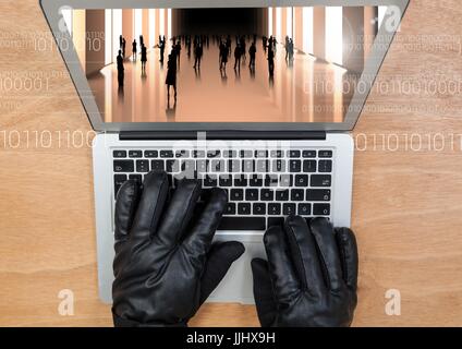 Aerial view of gloved hand typing on a laptop with 3d screen Stock Photo