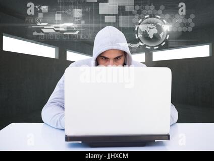 Hacker using a laptop in a dark room Stock Photo
