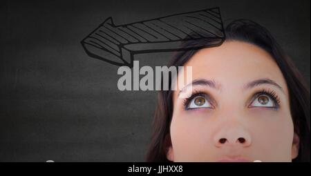 Top of woman's head looking at 3d grey arrow against grey wall Stock Photo