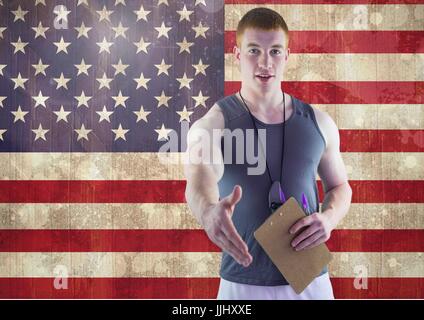 Sport coach shaking his hand against american flag Stock Photo