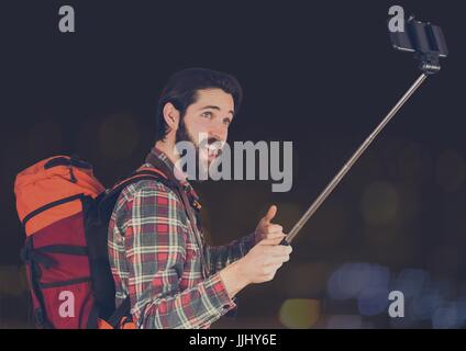 man taking a selfie with a backpack Stock Photo