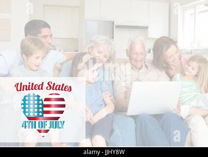 Happy family loong at the laptop for the 4th of July Stock Photo