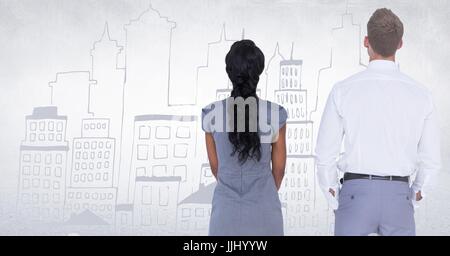 Back of business people looking at white wall with city doodle Stock Photo