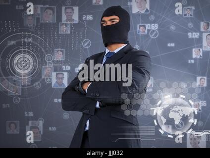 Businessman with hood and arms crossed in front of digital background Stock Photo