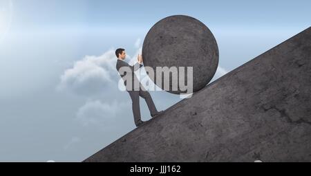 Man pushing rolling round rock Stock Photo