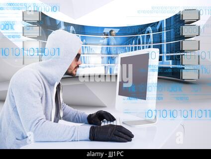 Hacker using a laptop in a data center Stock Photo