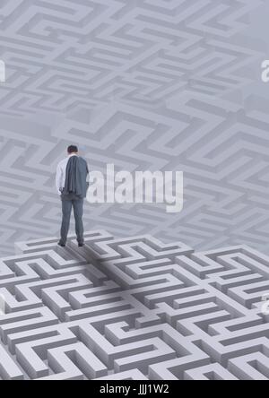 Man standing on a 3D maze against background with mazes Stock Photo