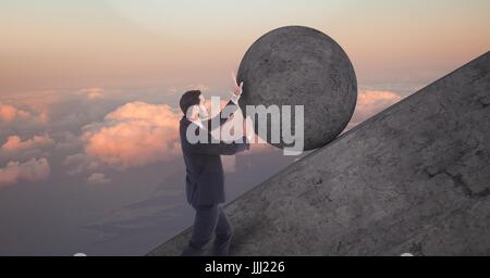 Man pushing 3D rolling round rock Stock Photo