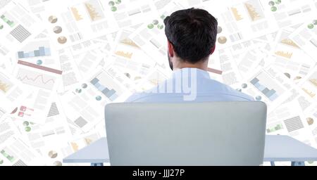 Back of business man at desk against document backdrop Stock Photo