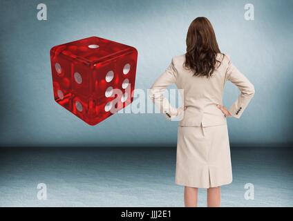 Back of woman Looking at 3d dice Stock Photo