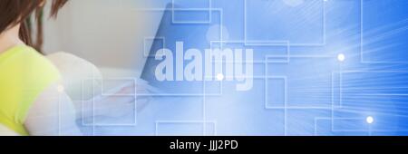 Back of woman typing on laptop with blue smart tech transition Stock Photo
