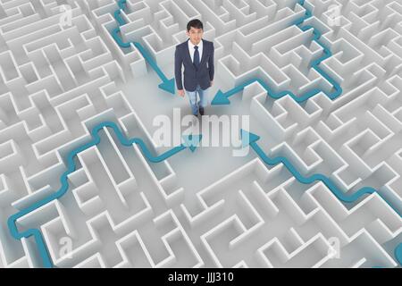 Man looking up in a maze Stock Photo