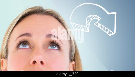 Top of woman's head looking at 3D white downward arrow against blue background Stock Photo