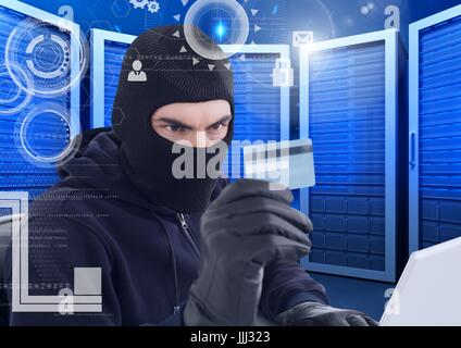 Hacker watching a credit card in a data center Stock Photo