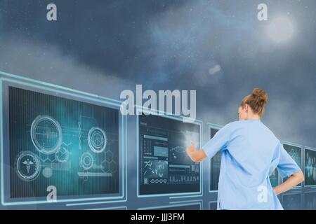 Woman doctor interacting with 3d medical interfaces against blue background with flares Stock Photo