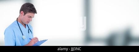 Doctor looking at clipboard against blurry grey office Stock Photo