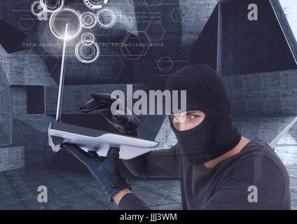 hacker using a laptop in a minimalist room Stock Photo