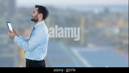 businessman  with tablet  in cityscape Stock Photo