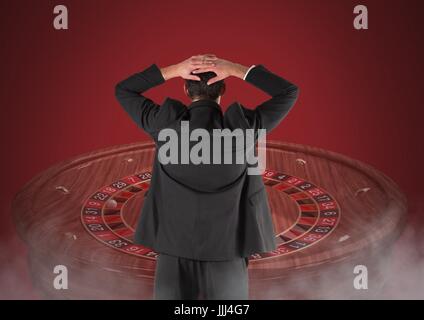 Back of Man Looking at 3d roulette Stock Photo
