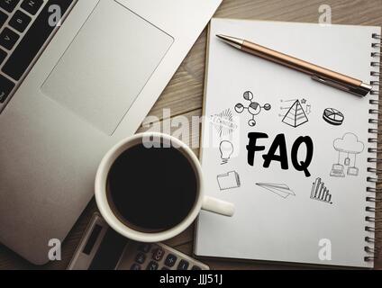 FAQ doodle on notepad next to coffee and laptop Stock Photo