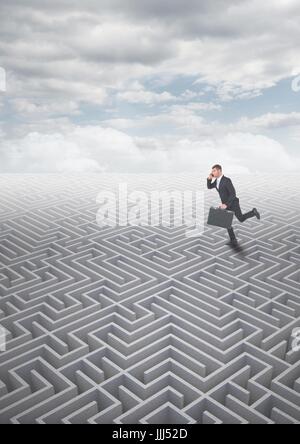 Man running on a 3d maze with clouds Stock Photo