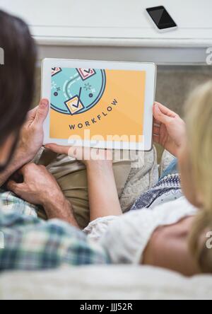 People looking at a tablet with education icon on the screen Stock Photo