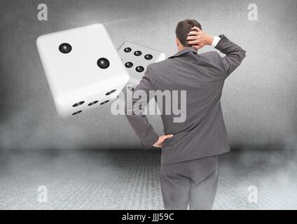 Back of Man Looking at 3d pair of dice Stock Photo