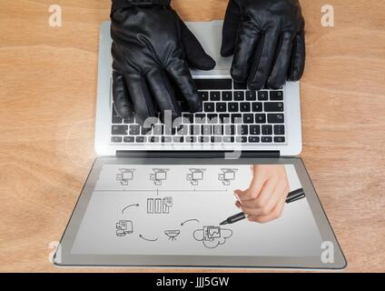 Hands with glove using a laptop with drawings on screen Stock Photo
