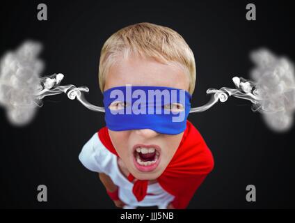 anger boy dressed like superhero with steam on ears. Black  background Stock Photo