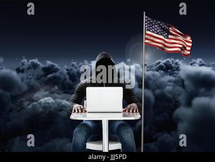 Hacker working on laptop close to the american flag with 3D cloudy background Stock Photo