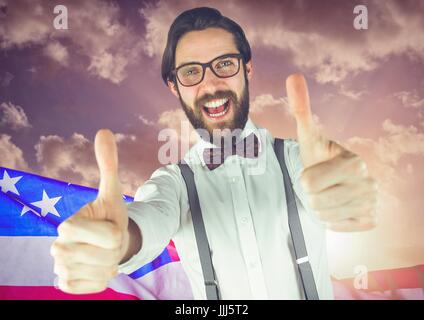 ThBusiness man with thumbs up against american flag Stock Photo