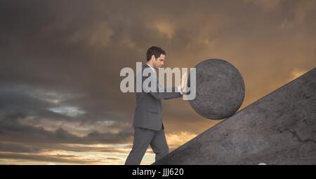 Man pushing 3D rolling round rock Stock Photo