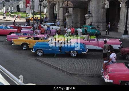 Colorful Cuban Convertible US Cars exhibited for Tourists to ride in while visiting Havana (La Habana), Cuba Stock Photo