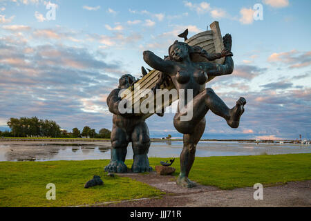 ESTONIA, KURESSAARE, SEPTEMBER 22, 2016: Statues of folk Estonian ?haracters Suur Toll and Piret in Kuressaare. Dawn over Saaremaa island Stock Photo