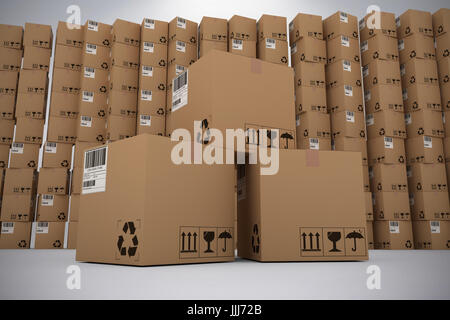 Composite image of pile of brown cardboard boxes Stock Photo