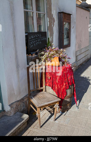 ESTONIA, KURESSAARE, SEPTEMBER 22, 2016 - Vintage cafe entrance with old chair and desk Stock Photo