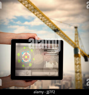Composite 3d image of close-up of hands holding digital tablet Stock Photo