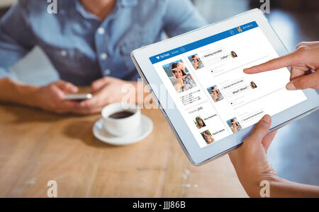 Person using 3d tablet computer in cafe Stock Photo